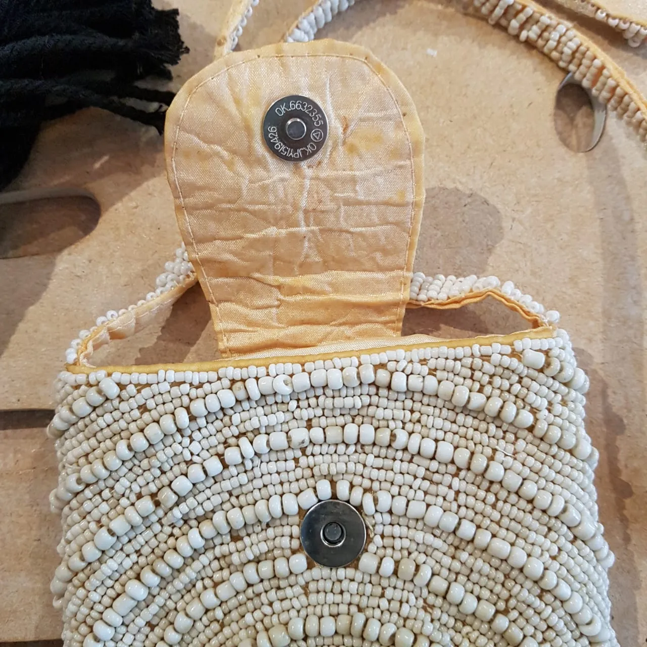 White Circle Pattern Woven Beaded Clutch With Long Strap